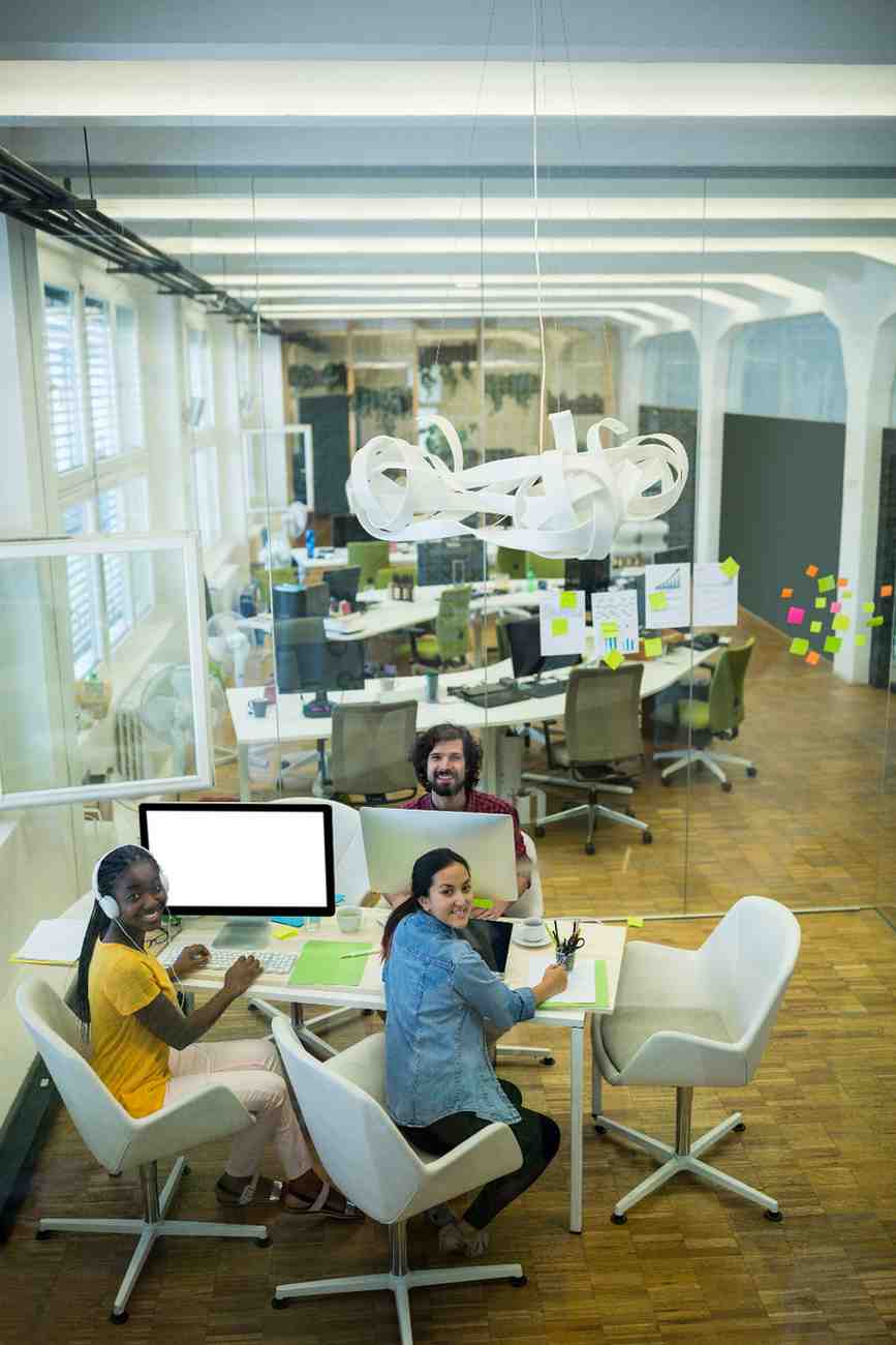 Digital marketing agency in Chennai team in a meeting room reviewing marketing tasks and next steps